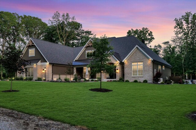 2611 Private Access 424, Mahomet, IL 61853 - craftsman-style home featuring stone siding, a lawn, and a standing seam roof