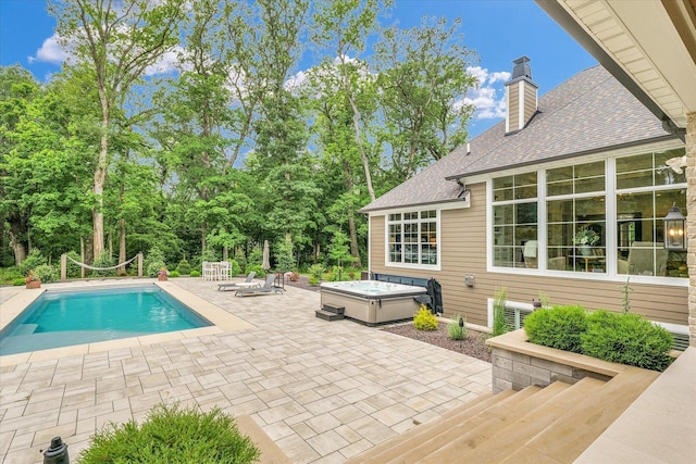 2611 Private Access 424, Mahomet, IL 61853 - swimming pool with a hot tub, a patio area, and view of scattered trees