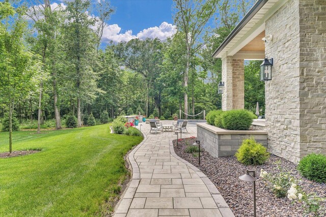 2611 Private Access 424, Mahomet, IL 61853 - view of grassy yard featuring a patio area