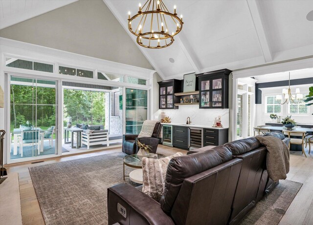 2611 Private Access 424, Mahomet, IL 61853 - living area featuring a chandelier, wine cooler, wet bar, high vaulted ceiling, and beam ceiling