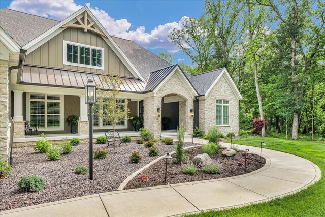 2611 Private Access 424, Mahomet, IL 61853 - craftsman-style house with a standing seam roof, board and batten siding, roof with shingles, a front lawn, and a metal roof
