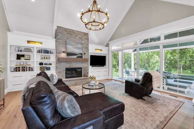 2611 Private Access 424, Mahomet, IL 61853 - living area featuring high vaulted ceiling, a chandelier, wood finished floors, and a fireplace