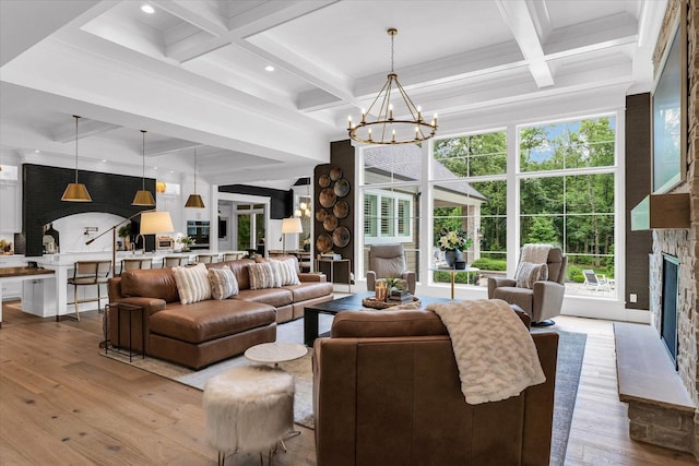 2611 Private Access 424, Mahomet, IL 61853 - living room with coffered ceiling, wood finished floors, a fireplace, beam ceiling, and a chandelier