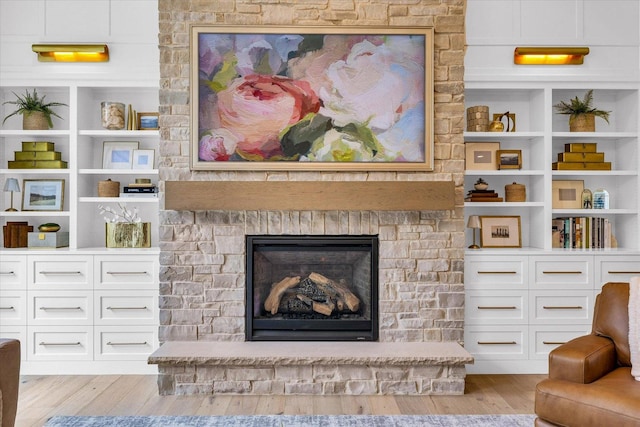 2611 Private Access 424, Mahomet, IL 61853 - living area featuring light wood-style floors, a fireplace, and built in features