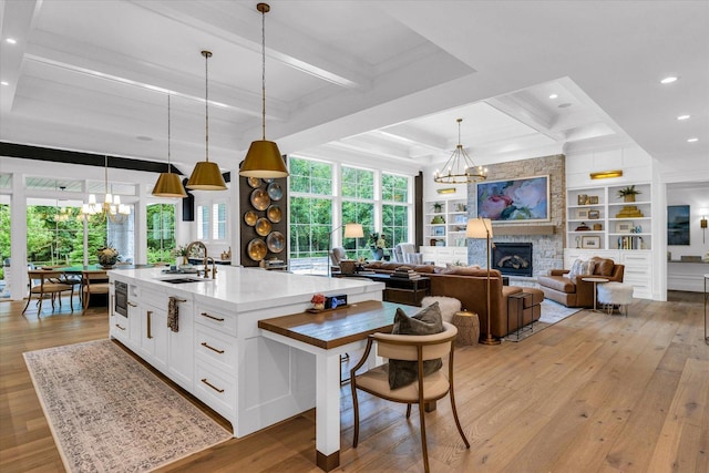 2611 Private Access 424, Mahomet, IL 61853 - kitchen featuring a chandelier, light wood-style floors, white cabinetry, recessed lighting, and beam ceiling