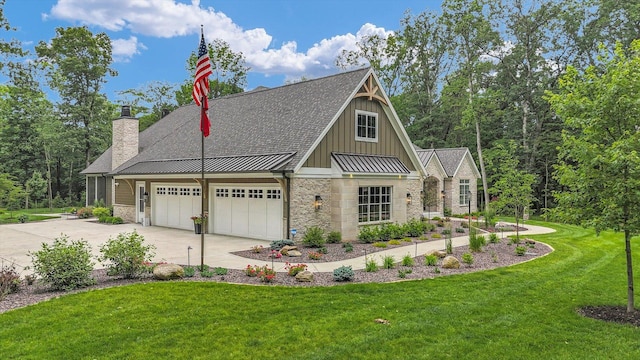 2611 Private Access 424, Mahomet, IL 61853 - view of front of house with stone siding, concrete driveway, board and batten siding, and a standing seam roof