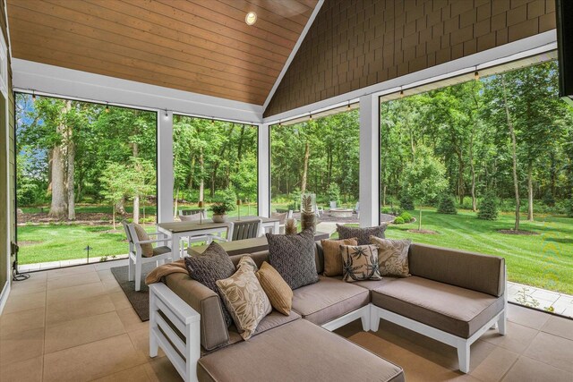 2611 Private Access 424, Mahomet, IL 61853 - sunroom with outdoor dining space, vaulted ceiling, and an outdoor hangout area