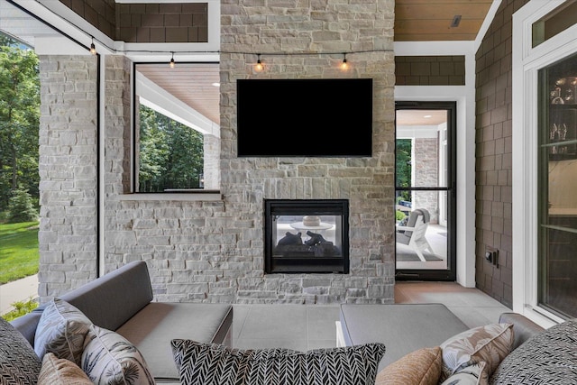 2611 Private Access 424, Mahomet, IL 61853 - living room featuring tile patterned floors and an outdoor stone fireplace