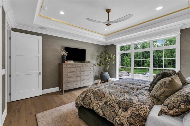 2611 Private Access 424, Mahomet, IL 61853 - bedroom featuring a tray ceiling, wood finished floors, crown molding, recessed lighting, and ceiling fan