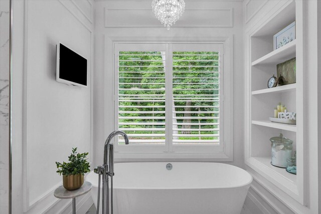 2611 Private Access 424, Mahomet, IL 61853 - full bath with a freestanding tub, a chandelier, and built in shelves