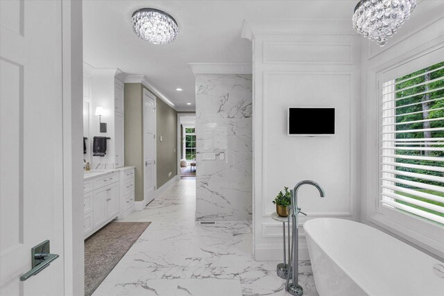 2611 Private Access 424, Mahomet, IL 61853 - bathroom with a chandelier, marble tiled floors, vanity, a soaking tub, and ornamental molding