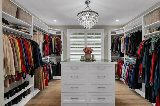 2611 Private Access 424, Mahomet, IL 61853 - spacious closet featuring a chandelier and light wood-style flooring