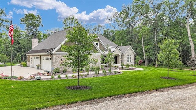2611 Private Access 424, Mahomet, IL 61853 - view of front facade with stone siding, concrete driveway, a chimney, and a front lawn