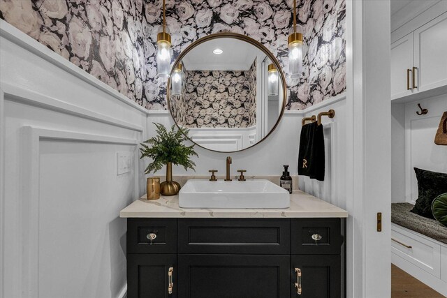 2611 Private Access 424, Mahomet, IL 61853 - bathroom with wallpapered walls, vanity, and wood finished floors