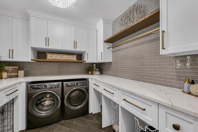 2611 Private Access 424, Mahomet, IL 61853 - laundry area with washing machine and dryer, cabinet space, and dark marble finish flooring