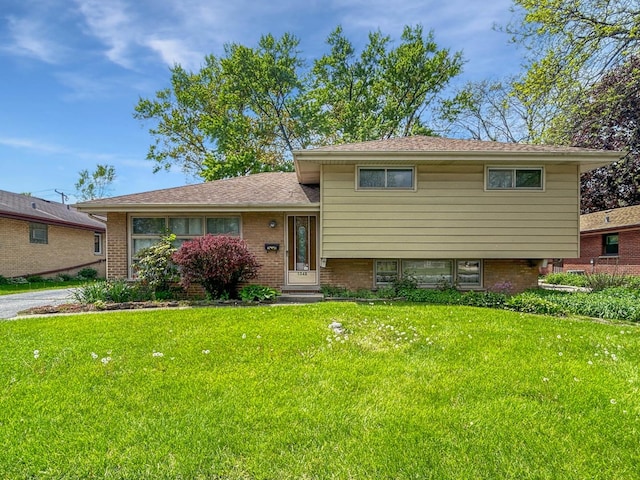 1048 Marshall Dr, Des Plaines, IL 60016 - tri-level home with a front lawn and brick siding