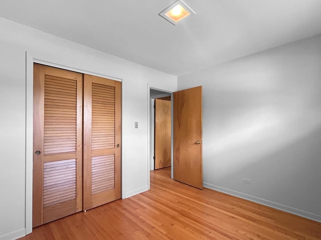 1048 Marshall Dr, Des Plaines, IL 60016 - unfurnished bedroom featuring a closet and light wood-style floors