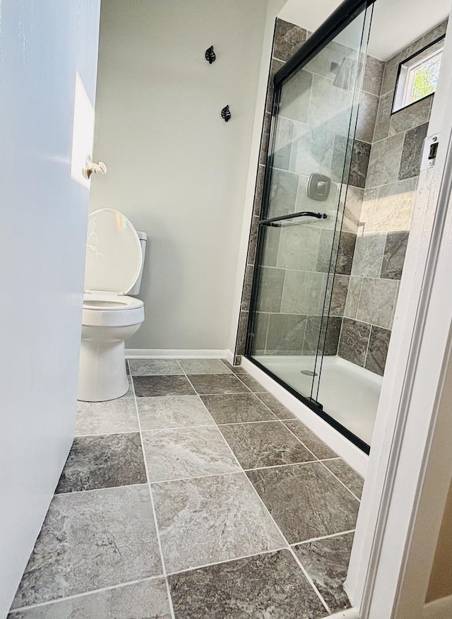 325 Shadowbend Dr, Wheeling, IL 60090 - bathroom featuring a stall shower and stone tile flooring
