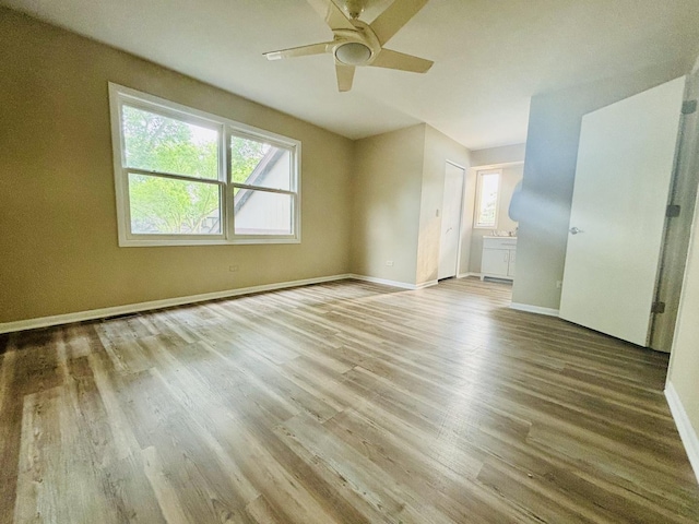 325 Shadowbend Dr, Wheeling, IL 60090 - unfurnished room with plenty of natural light, wood finished floors, and a ceiling fan