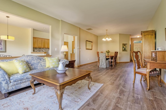 13504 S Buckthorn Ln, Plainfield, IL 60544 - living area featuring a chandelier and wood finished floors