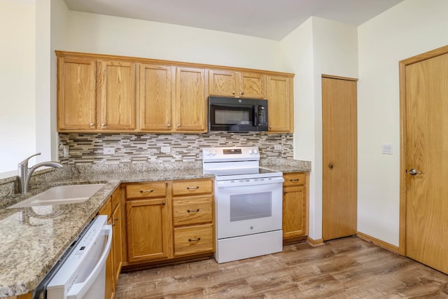 13504 S Buckthorn Ln, Plainfield, IL 60544 - kitchen featuring white appliances, tasteful backsplash, light wood-style flooring, and light stone countertops