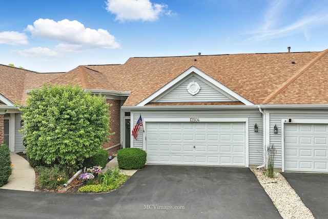 13504 S Buckthorn Ln, Plainfield, IL 60544 - view of front of property with asphalt driveway, a shingled roof, and an attached garage