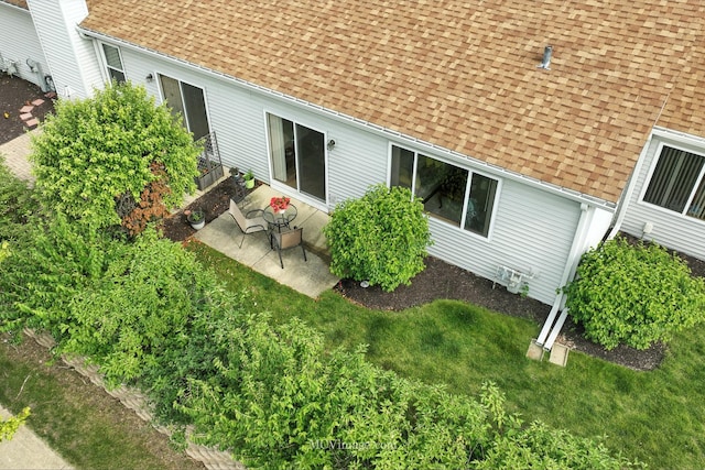 13504 S Buckthorn Ln, Plainfield, IL 60544 - back of house featuring a shingled roof and a patio area