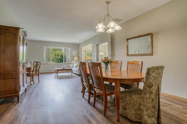 13504 S Buckthorn Ln, Plainfield, IL 60544 - dining space with wood finished floors and a chandelier