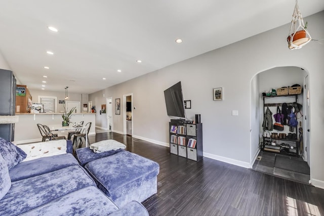 2150 W Coulter St, Chicago, IL 60608 - living area featuring arched walkways, recessed lighting, and wood finished floors