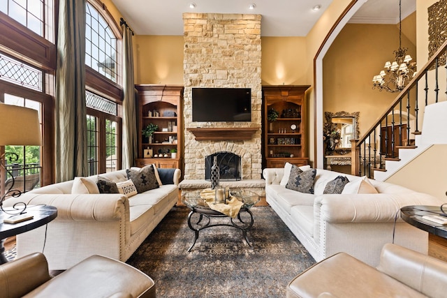 7N230 Sims Ln, Saint Charles, IL 60175 - living area with a stone fireplace, a chandelier, and stairs