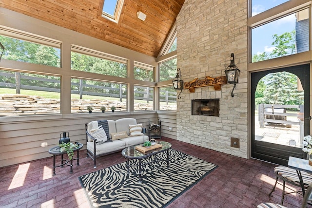 7N230 Sims Ln, Saint Charles, IL 60175 - sunroom / solarium featuring lofted ceiling, an outdoor living space with a fireplace, and a skylight