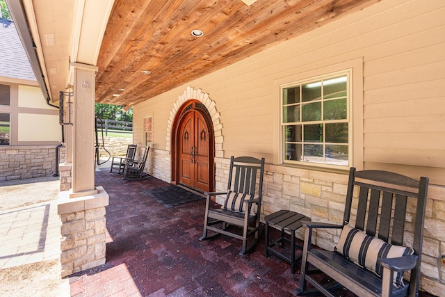 7N230 Sims Ln, Saint Charles, IL 60175 - view of exterior entry featuring stone siding and a porch