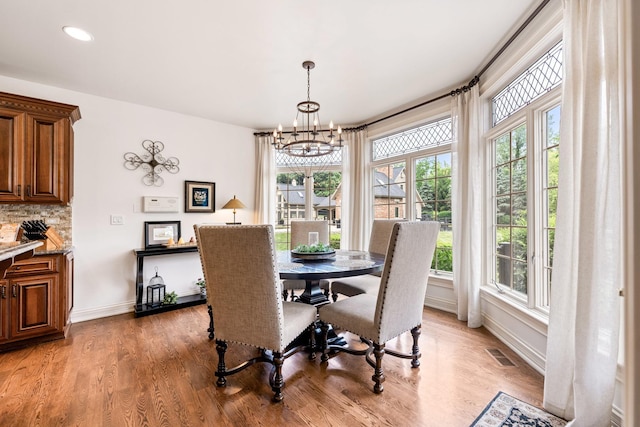 7N230 Sims Ln, Saint Charles, IL 60175 - dining area with light wood-style flooring, a chandelier, and recessed lighting