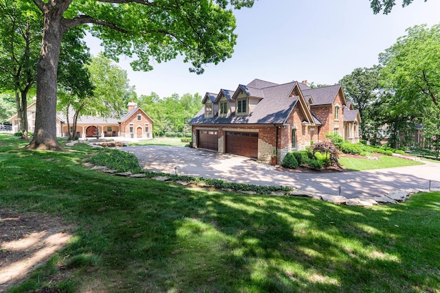 7N230 Sims Ln, Saint Charles, IL 60175 - view of front facade with an attached garage, asphalt driveway, brick siding, and a front lawn