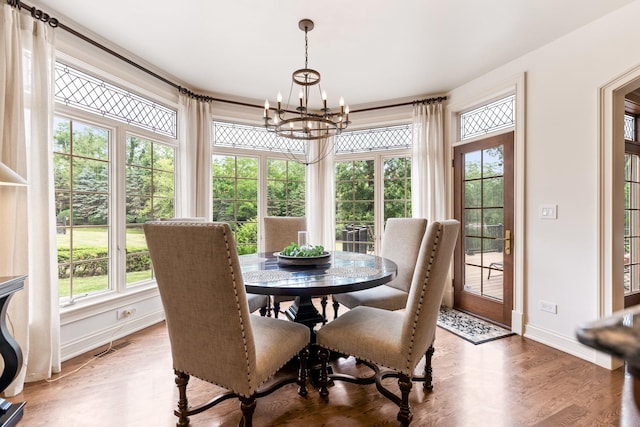 7N230 Sims Ln, Saint Charles, IL 60175 - dining room featuring a chandelier and light wood-style flooring