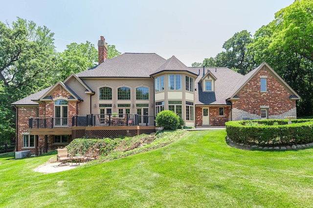 7N230 Sims Ln, Saint Charles, IL 60175 - back of house with a deck, a yard, brick siding, a chimney, and a patio area