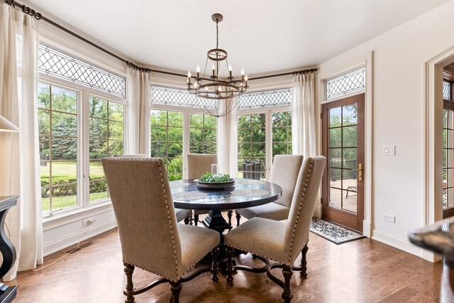 7N230 Sims Ln, Saint Charles, IL 60175 - dining room featuring a chandelier and light wood-style flooring