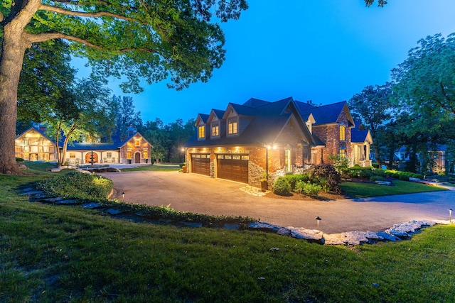 7N230 Sims Ln, Saint Charles, IL 60175 - view of front of house with an attached garage, a front lawn, and driveway