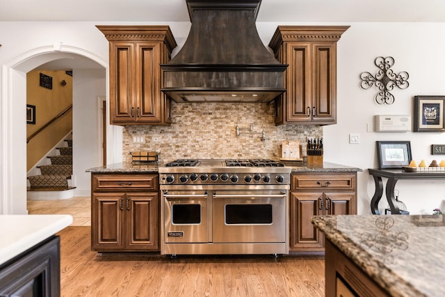 7N230 Sims Ln, Saint Charles, IL 60175 - kitchen featuring double oven range, custom range hood, tasteful backsplash, and stone counters
