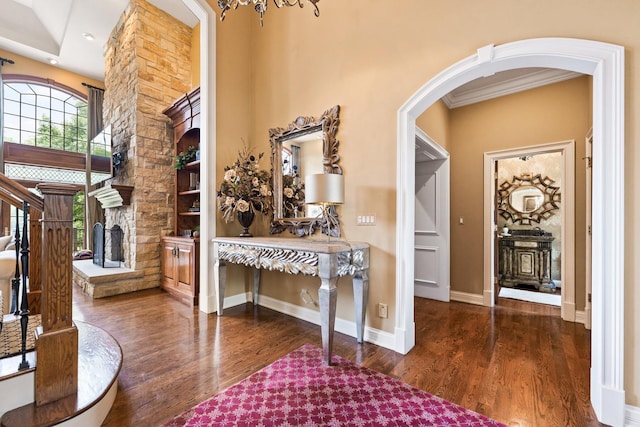 7N230 Sims Ln, Saint Charles, IL 60175 - entrance foyer featuring arched walkways, wood finished floors, and a stone fireplace