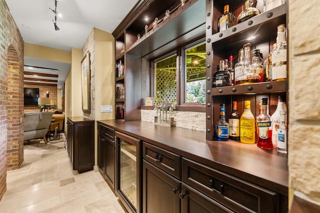 7N230 Sims Ln, Saint Charles, IL 60175 - indoor dry bar featuring wine cooler, brick wall, and light stone finish flooring