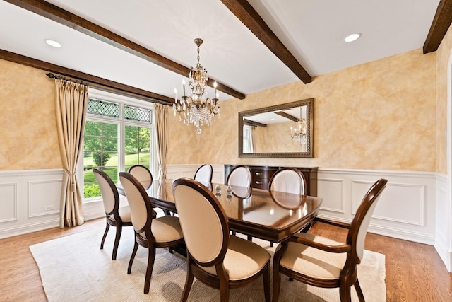 7N230 Sims Ln, Saint Charles, IL 60175 - dining space featuring a chandelier, a decorative wall, light wood-style flooring, beamed ceiling, and wainscoting