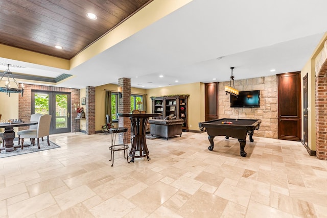 7N230 Sims Ln, Saint Charles, IL 60175 - playroom with billiards, decorative columns, stone tile flooring, a tray ceiling, and recessed lighting