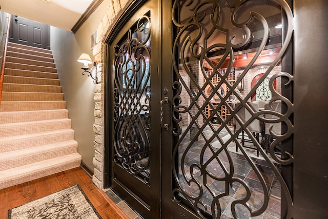 7N230 Sims Ln, Saint Charles, IL 60175 - entryway featuring wood finished floors, stairway, and crown molding