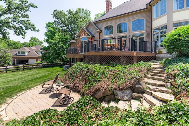 7N230 Sims Ln, Saint Charles, IL 60175 - back of house featuring a patio, a wooden deck, and a chimney