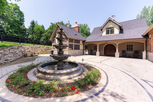 7N230 Sims Ln, Saint Charles, IL 60175 - view of front facade with stone siding and a shingled roof