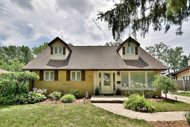 220 E Park Ave, Bloomingdale, IL 60108 - view of front facade with brick siding, a shingled roof, a front yard, and covered porch