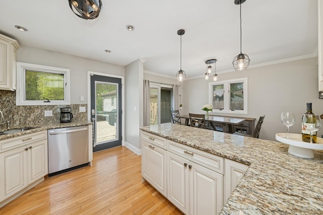 220 E Park Ave, Bloomingdale, IL 60108 - kitchen featuring dishwasher, tasteful backsplash, decorative light fixtures, light wood-style floors, and crown molding