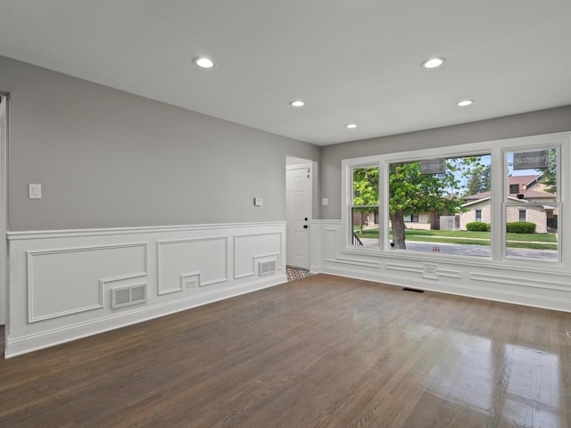 15035 Evers St, Dolton, IL 60419 - empty room with wood finished floors, recessed lighting, a wainscoted wall, and a decorative wall