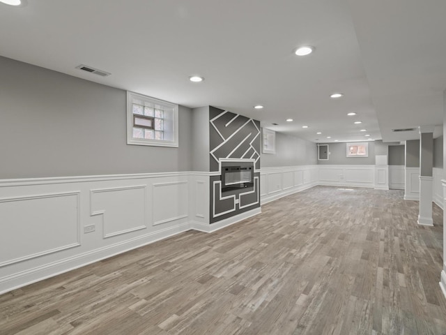 15035 Evers St, Dolton, IL 60419 - basement featuring a decorative wall, wood finished floors, a fireplace, recessed lighting, and a wainscoted wall